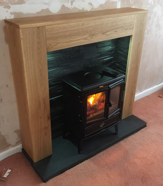 Black slate Chamber with oak fire surround