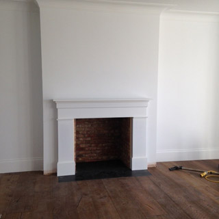 Bespoke whte fire surround