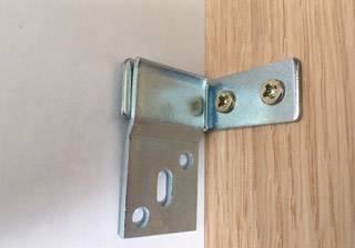 Fire surround fixing brackets